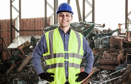 Waste clearance staff organizing and removing debris